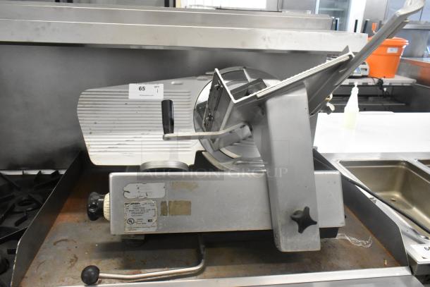 Bizerba SE 12 D US metal commercial meat slicer, 120 volts, 1 phase, used condition, with manufacturer labels visible.