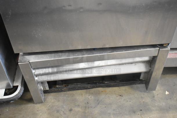 True T-23F Stainless Steel Commercial Single Door Reach-In Cooler, 115 Volts, 1 Phase, visible wear on lower section.