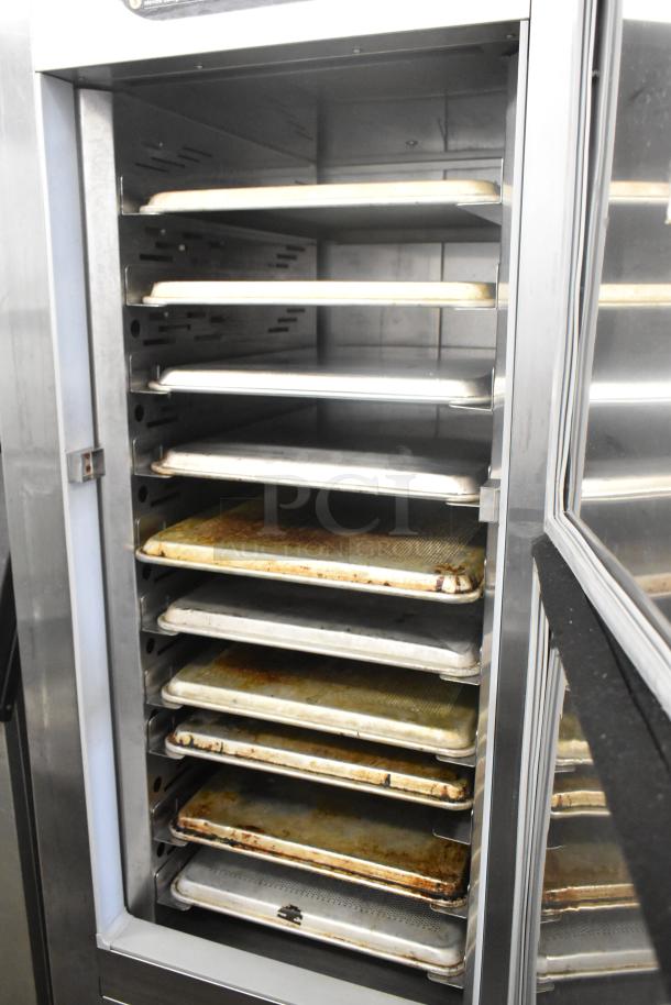Traulsen RAC-37 stainless steel 2-door reach-in air curtain cooler with trays. On commercial casters. Model: RAC-37. 120V, 1 Phase.