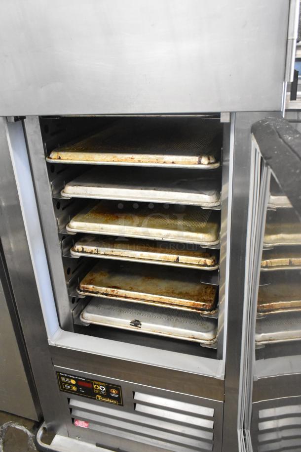Traulsen RAC-37 stainless steel 2-door air curtain cooler, commercial casters, visible shelves, used condition.