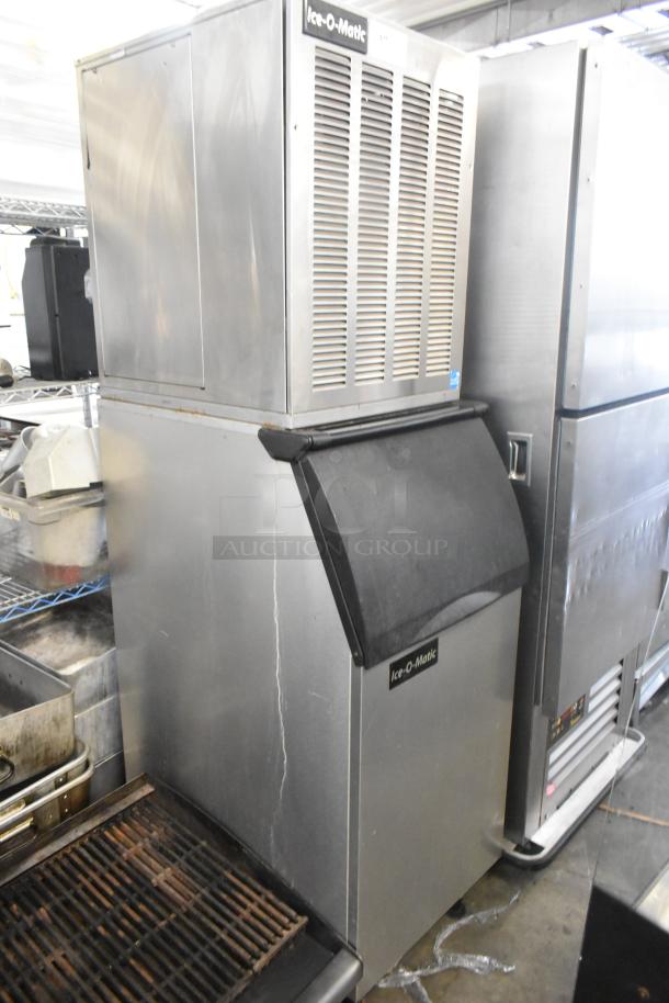 2016 Ice O Matic MFI0500A2 stainless steel commercial ice head on bin, 115V, 1 phase, good condition, model details visible.