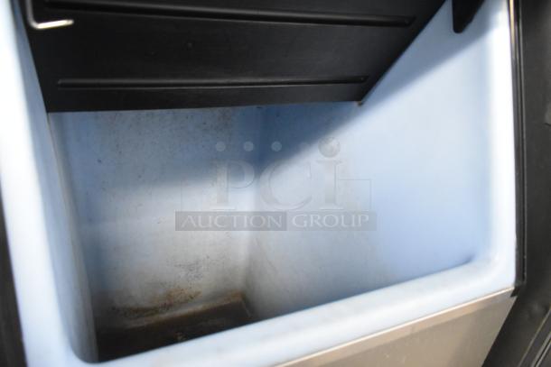 2016 Ice O Matic MFI0500A2 stainless steel commercial ice head and bin, interior view, 115 volts, 1 phase, used condition.