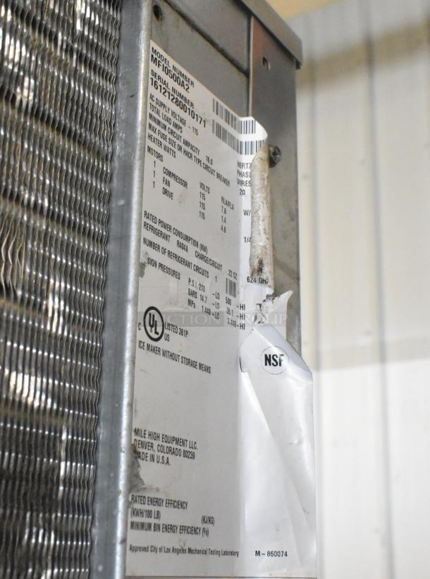 2016 Ice O Matic MFI0500A2 stainless steel commercial ice head on bin; tag shows 115V, 1 Phase, NSF certified.