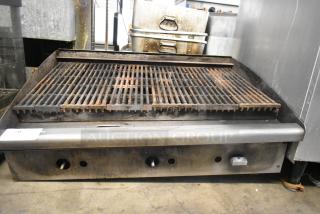 Stainless Steel Commercial Countertop Gas Charbroiler Grill, used, visible wear, adjustable knobs, heavy-duty grates.