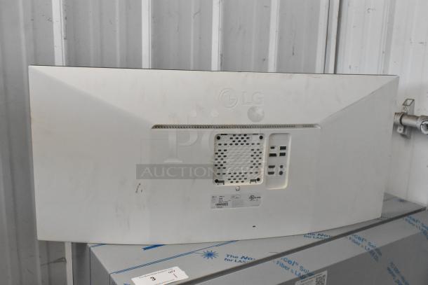 2023 LG 38WN95C Curved TV in original box, showing rear inputs and LG branding, wires not included. Buyer pick-up only.