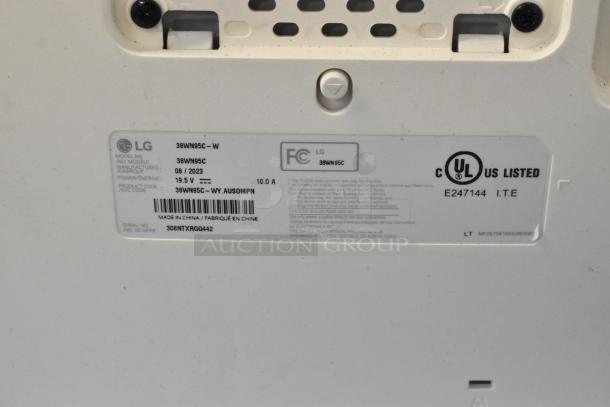 Alt text: LG 38WN95C Curved TV label showing model, manufacture date, power specs, and safety certifications.