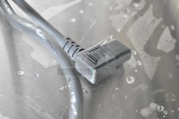 Close-up of a power cord on a stainless steel surface, likely for the KoolMore KM-CBLC-5 blast chiller.
