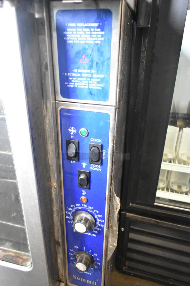 US Range stainless steel convection oven with view-through doors, metal racks, and thermostatic controls visible.