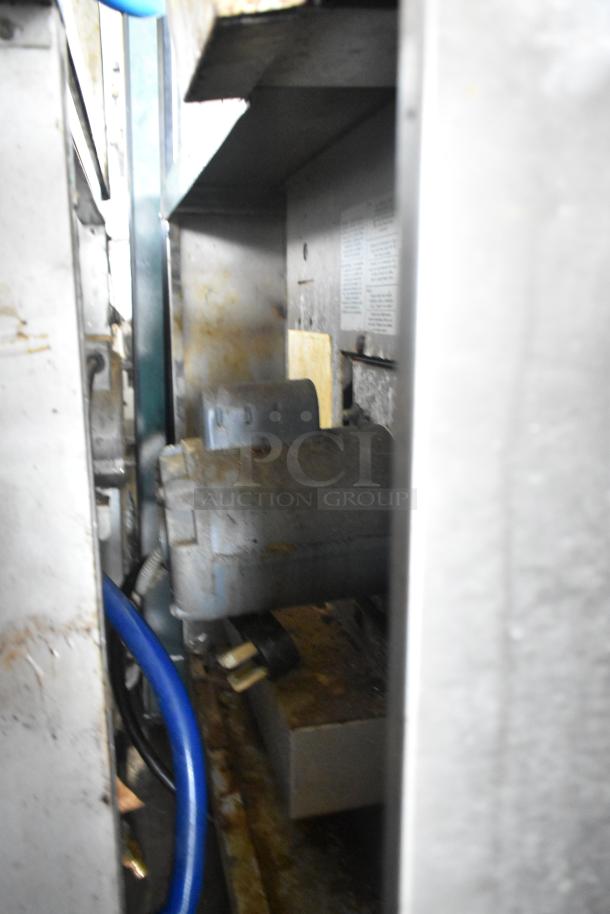 US Range stainless steel convection oven with view-through doors, metal racks, thermostatic controls, commercial grade.