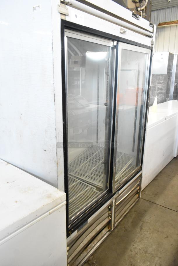 Leader ESLS54SC metal commercial 2-door reach-in cooler merchandiser, 115 volts, 1 phase, visible wear on exterior.