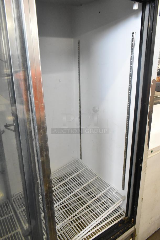 Leader ESLS54SC 2 Door Reach In Cooler, metal, commercial use. Features adjustable shelving. Condition shows light wear.