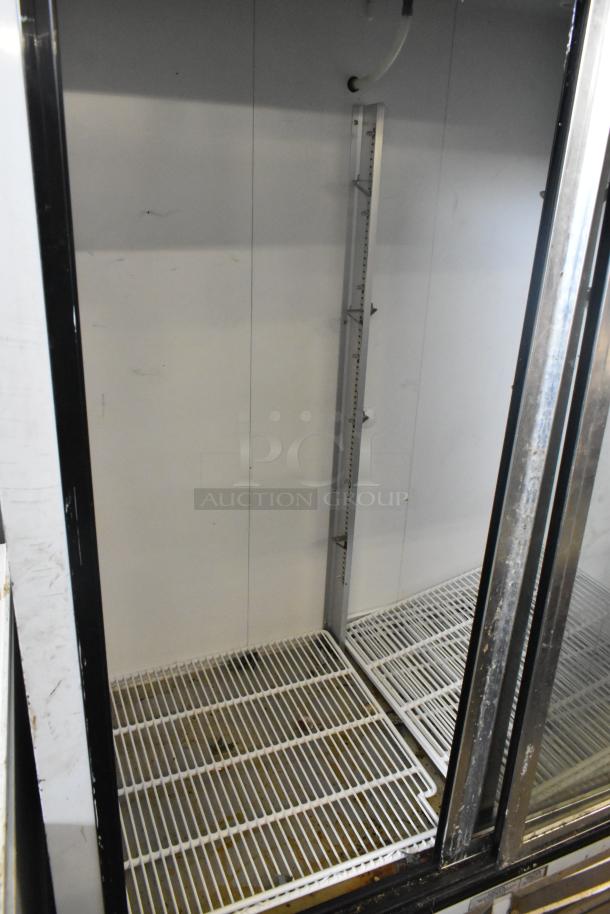 Leader ESLS54SC Metal Commercial 2 Door Cooler Merchandiser, good condition, 115V, 1 Phase, interior shelves shown.