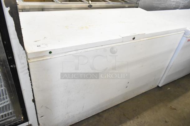 Frigidaire FFFC18M4RWA chest freezer with hinge lid, 115 volts, 1 phase. Some visible wear and markings.