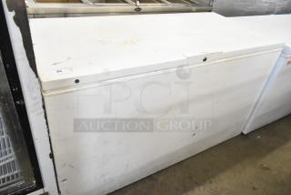 Frigidaire FFFC18M4RWA chest freezer with hinge lid, 115 volts, 1 phase. Some visible wear and markings.