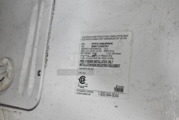 Frigidaire FFFC18M4RWA chest freezer label showing model, voltage, refrigerant, and installation details.