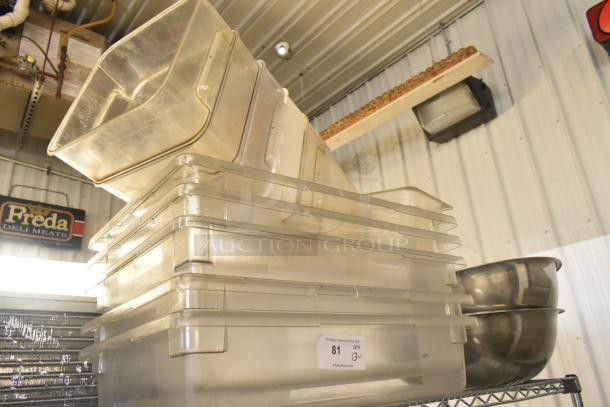 Lot of poly clear bins and metal bowls, stacked. Clear bins show slight wear, label indicates auction lot number 81.