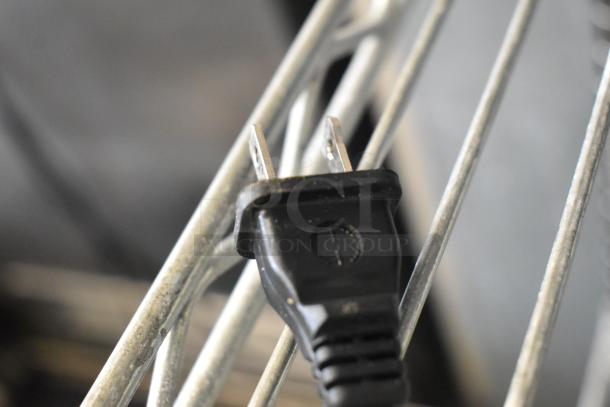 Power plug of a Bella TSK-1187R5B Single Cup Coffee Machine, 120 volts, 1 phase. Close-up view.
