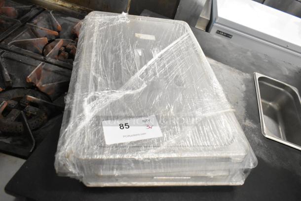 Lot of 3 poly clear lids wrapped in plastic, new condition, auction tag labeled "85 QTY 3".