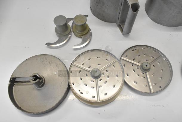 11 kitchen items including continuous feed head, 2 bowls, 2 S blades, 3 slicing blades, and 3 grating blades.