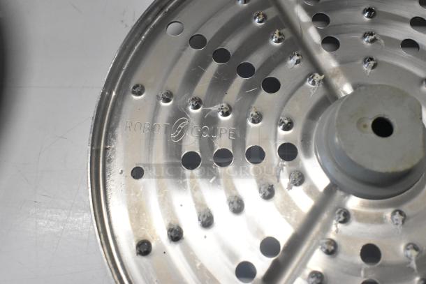 11-piece set including continuous feed head, 2 bowls, 2 S blades, 3 slicing and 3 grating blades. Robot Coupe marked.