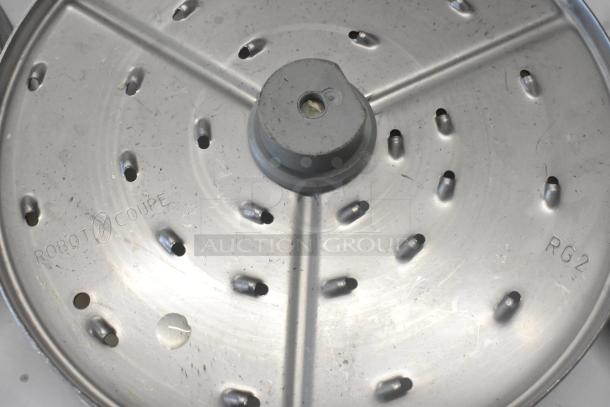 11-piece set including a Robot Coupe slicing blade marked "RG2", in used condition.