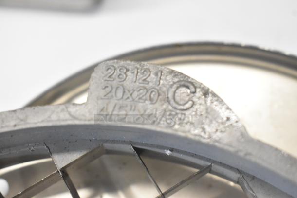 Close-up of a metal blade component with markings: "28121, 20x20 C, 4/5"x4/5"." Part of an 11-item kitchen set.