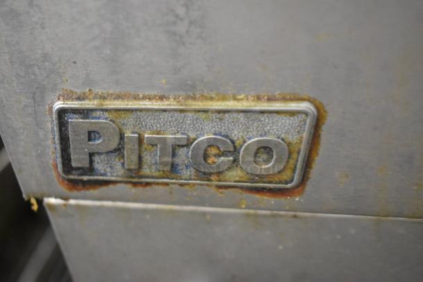 Pitco Frialator 40D fryer badge on stainless steel surface, showing signs of wear and discoloration.