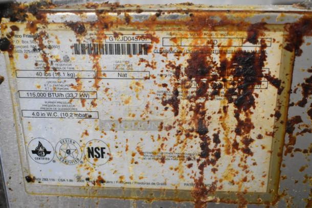 Pitco Frialator 40D deep fryer label, shows 115,000 BTU, natural gas, NSF certified. Rust and stains present.