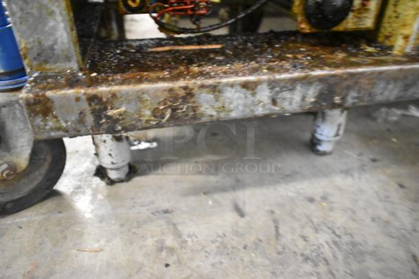 Pitco Frialator 40D fryer base with visible wear and grease residue, showing wheel and stand condition.