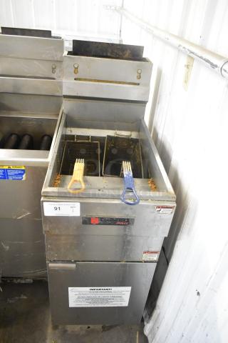 Cecilware Pro stainless steel commercial gas fryer with two metal fry baskets. Visible labels indicate model and safety instructions.