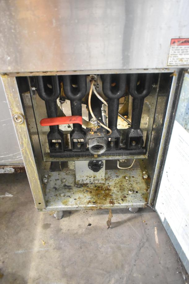 Cecilware Pro stainless steel floor gas fryer, open interior view, with red-handled controls, visible wear and residue.