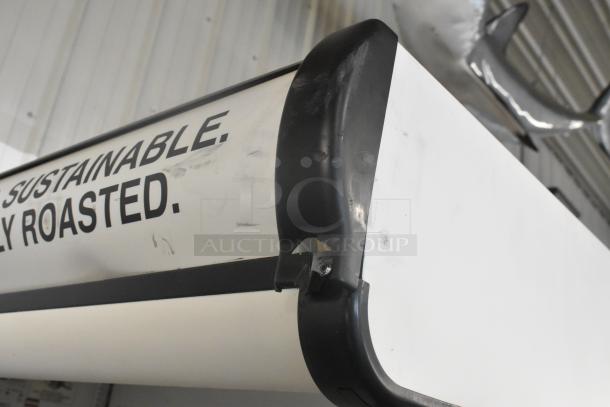 True TAC-48GS-LD Metal Open Grab N Go Merchandiser with minor wear. Features text "SUSTAINABLE. | Y ROASTED." 208-230V, 1 Phase.