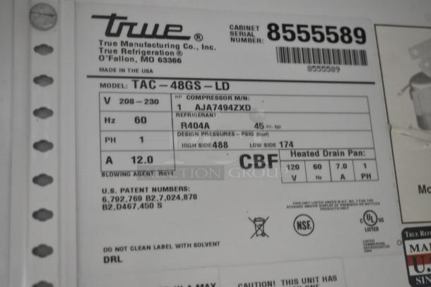 Label for True TAC-48GS-LD Merchandiser, 208-230V, 1 Phase, R404A refrigerant, compressor model AJA7494ZXD. Serial 8555589.