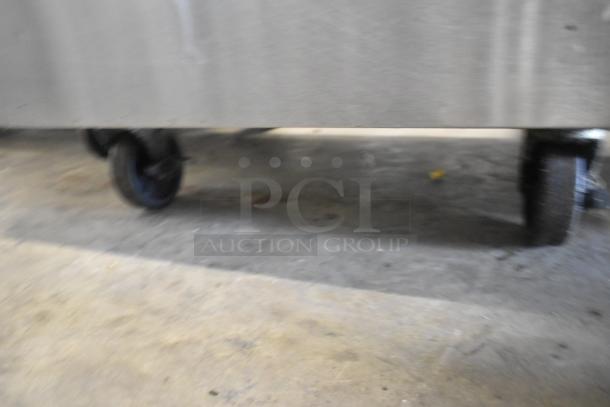 2017 Bison BST-27 stainless steel work top cooler, single door, on commercial casters, 115V, 1 phase.