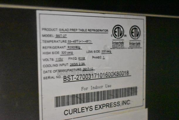 2017 Bison BST-27 Stainless Steel Cooler label. Shows model, voltage, refrigerant, and manufacturing date. ETL certified.