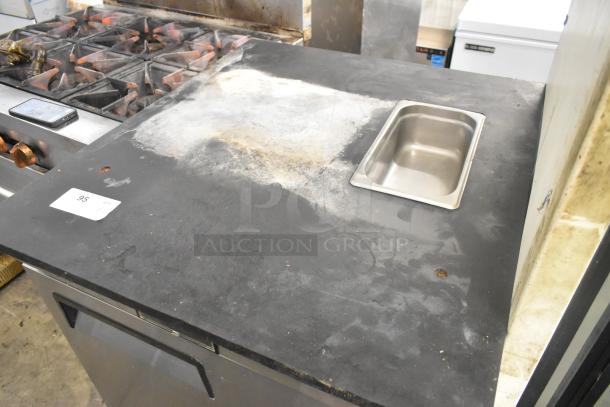 2017 Bison BST-27 Stainless Steel Single Door Work Top Cooler on casters, 115V, showing wear, with inset container.