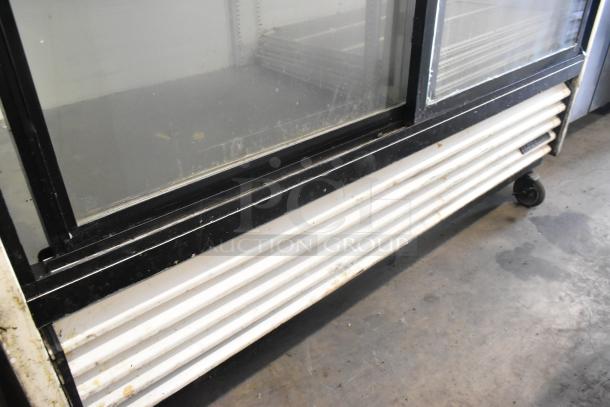 True GDM-61 commercial 2-door reach-in cooler on casters, 115V, metal, used condition, visible wear, model GDM-61.