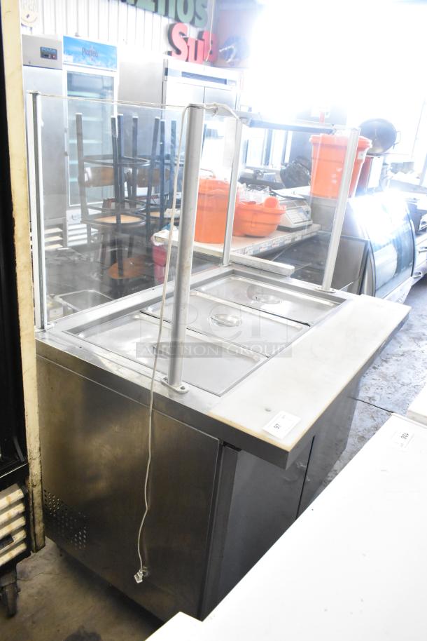 Coldline SMP48 stainless steel prep table with sneeze guard, commercial casters, 115 volts, 1 phase, clean condition.