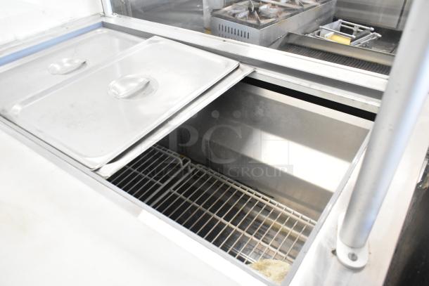 Coldline SMP48 stainless steel prep table with sneeze guard and commercial casters, 115V, 1 Phase, open storage view.
