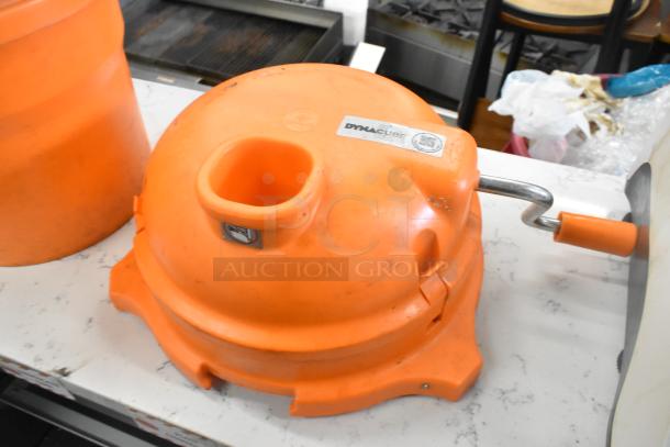 Orange Dynacube vegetable cutter with handle; includes lettuce spinner. Durable condition, suitable for kitchen use.