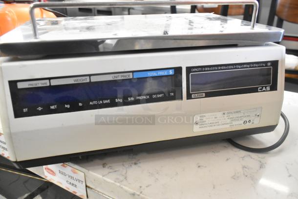 CAS CL5500-B metal countertop food portioning scale, 120V, features tare, weight, unit price display. Model plate visible.