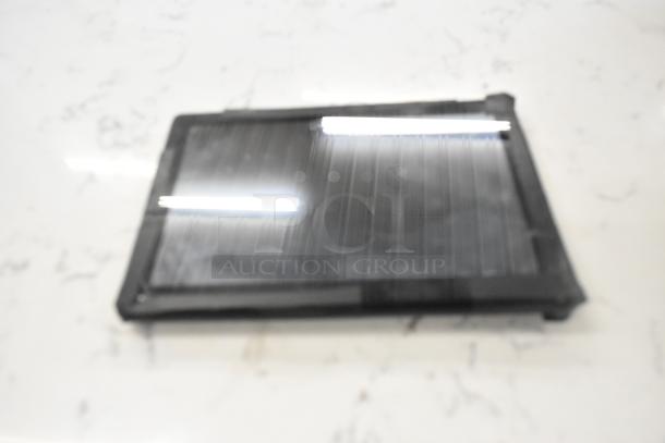 Blurry image of a T8 Tablet on a marble surface. Condition unclear due to image quality.