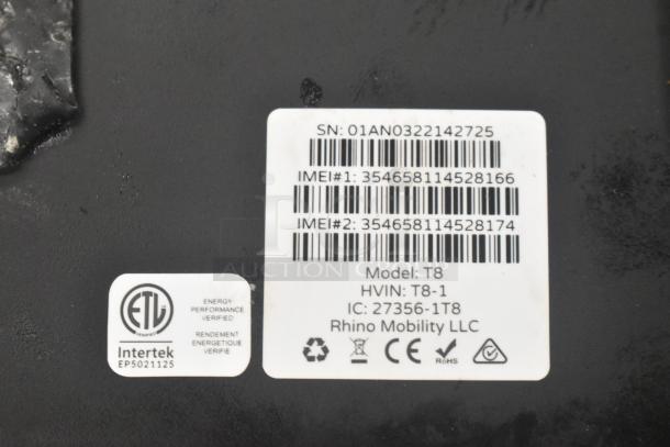 T8 Tablet label showing serial number, IMEI numbers, model T8, brand Rhino Mobility LLC, with certification logos.
