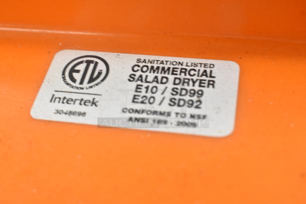 Orange commercial salad dryer label, ETL sanitation listed, models E10/SD99 and E20/SD92, conforms to NSF ANSI 169-2009.