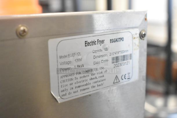 2023 Eggkitpo EGEF-12L fryer label showing model, voltage (120V), power (1.8kW), and dimensions. Approved for commercial use.