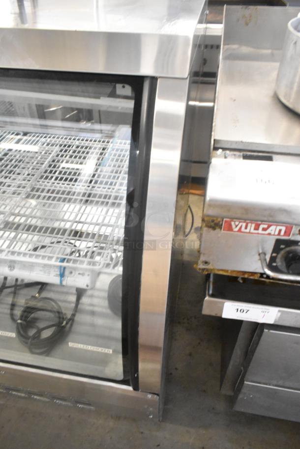 Universal FCI-48 metal deli display case, commercial floor style, glass doors, 115 volts, 1 phase, good condition.