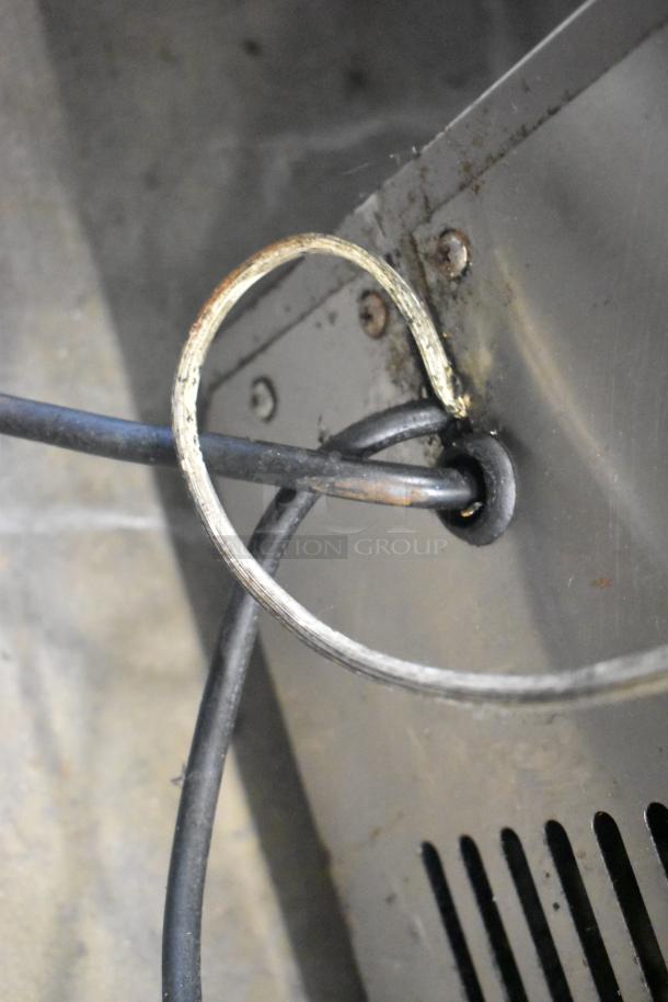 Close-up of Universal FCI-48 deli display case wiring, showing metal frame and cable connections, used condition.