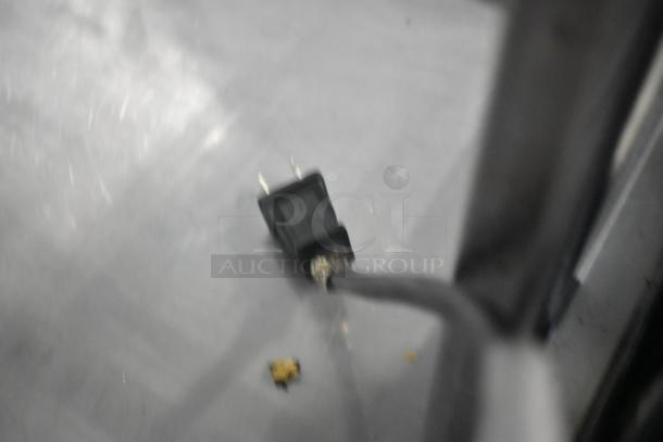 Universal FCI-48 metal deli display case plug, 115V, 1 phase, shows minimal wear. Features durable floor-style design.