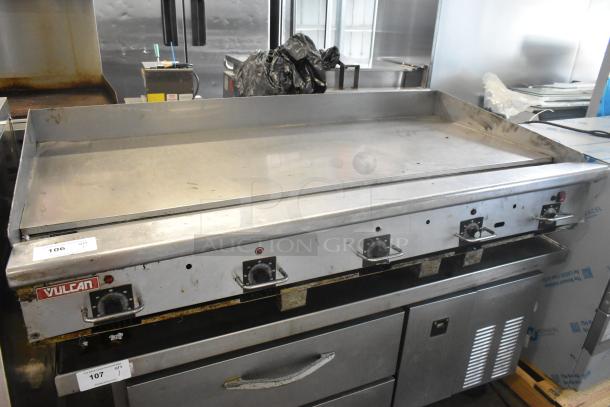 Vulcan stainless steel commercial gas griddle, flat top, thermostatic controls, minor wear, item tags visible.
