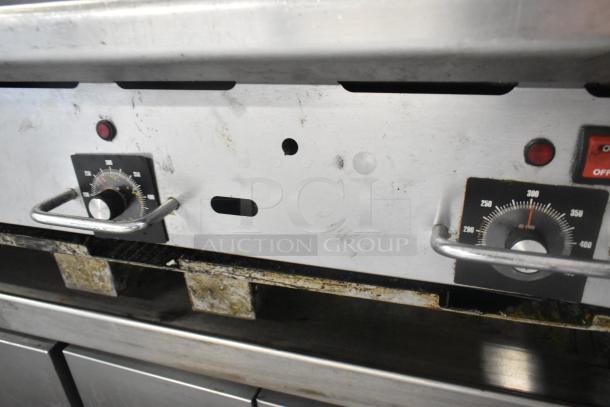 Vulcan stainless steel commercial gas griddle with thermostatic controls, used condition, visible dials for temperature control.